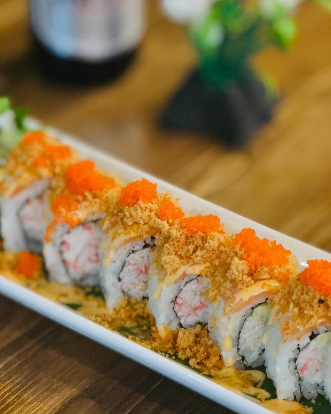 Sushi rolls topped with tobiko